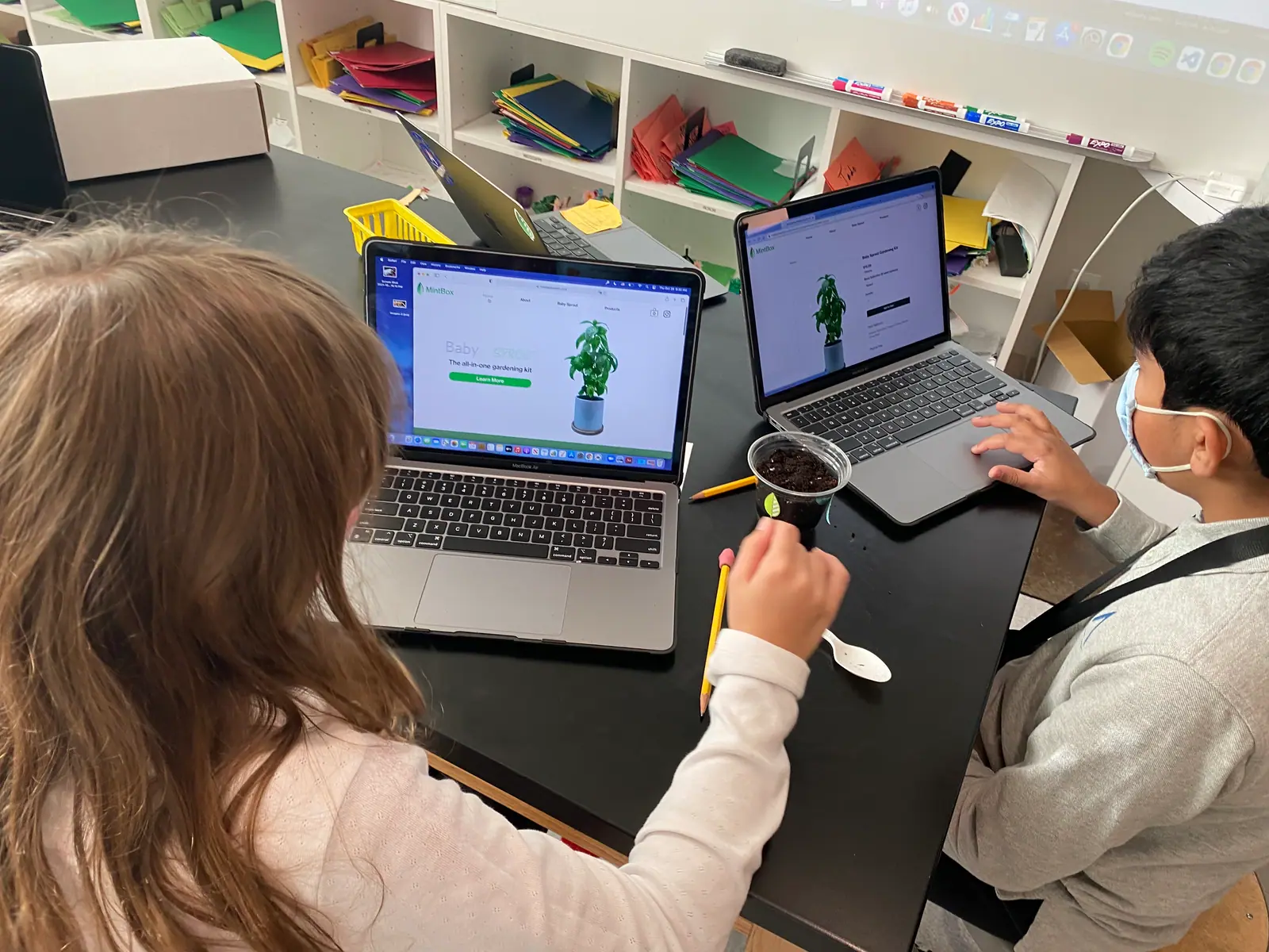 A Baby Sprout EDU kit with the printed curriculum beside it.
